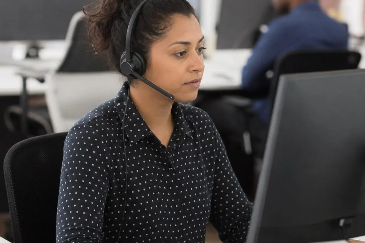 Call center agent concentrating at a customer service workstation